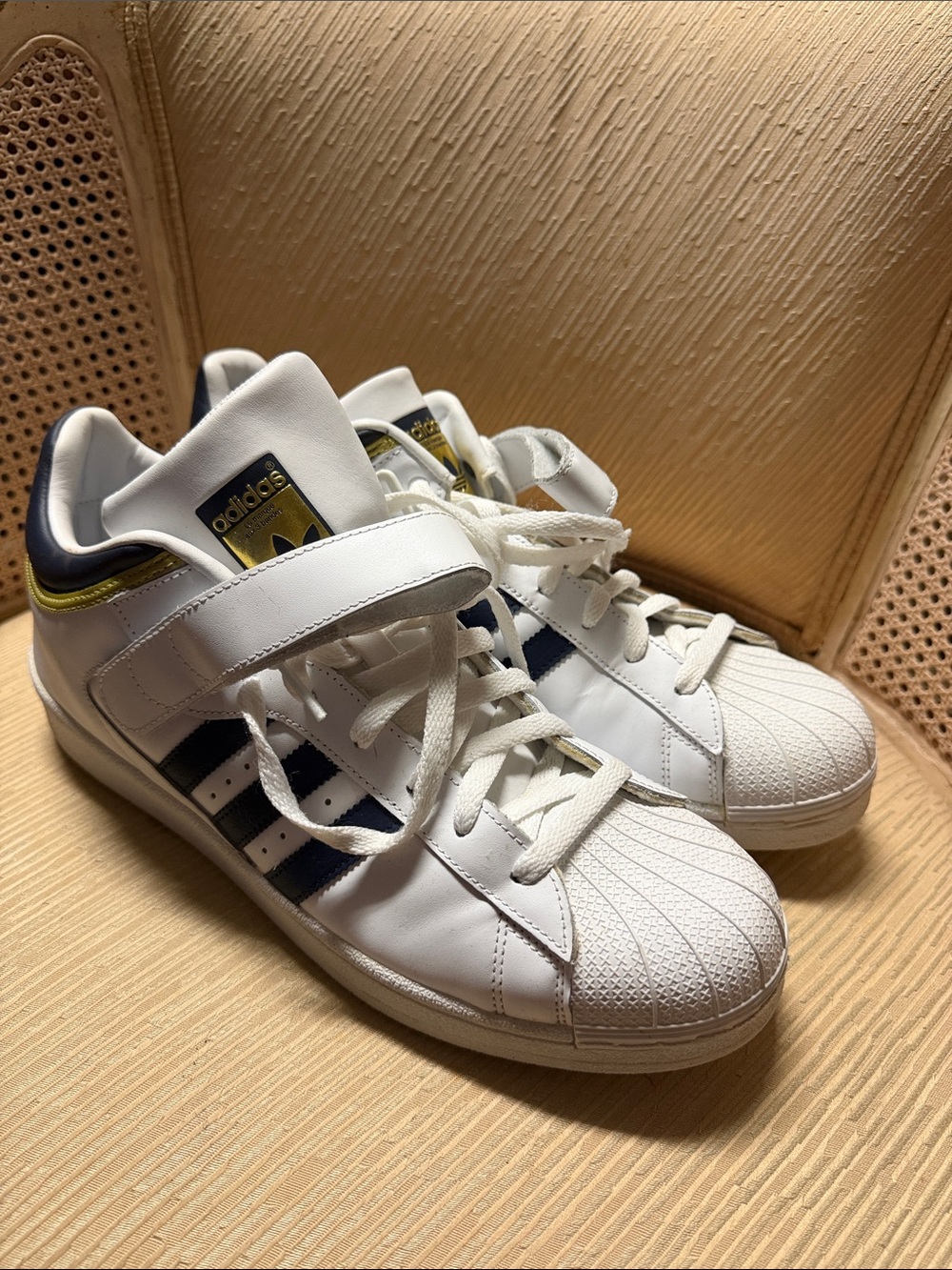 adidas men’s White Sneakers with Navy Stripes and Gold Accents
